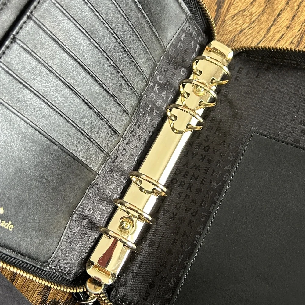 Black leather Kate Spade Wellesley zip around personal organizer/planner